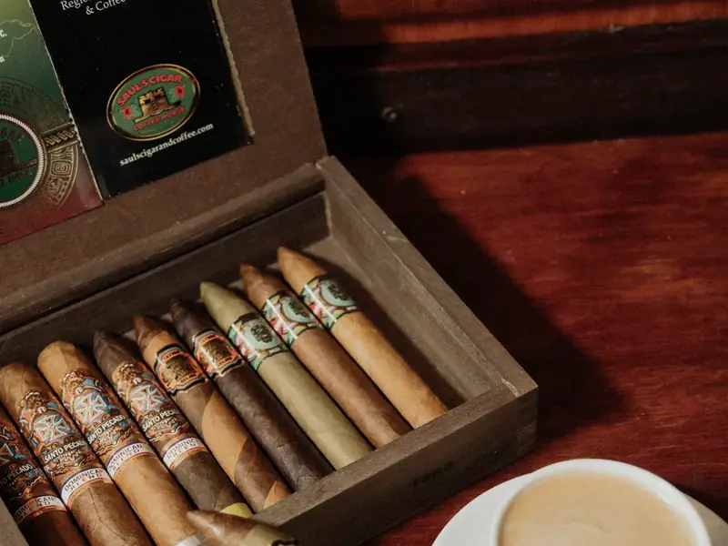 Saul's wooden cigar box, open, with a coffee